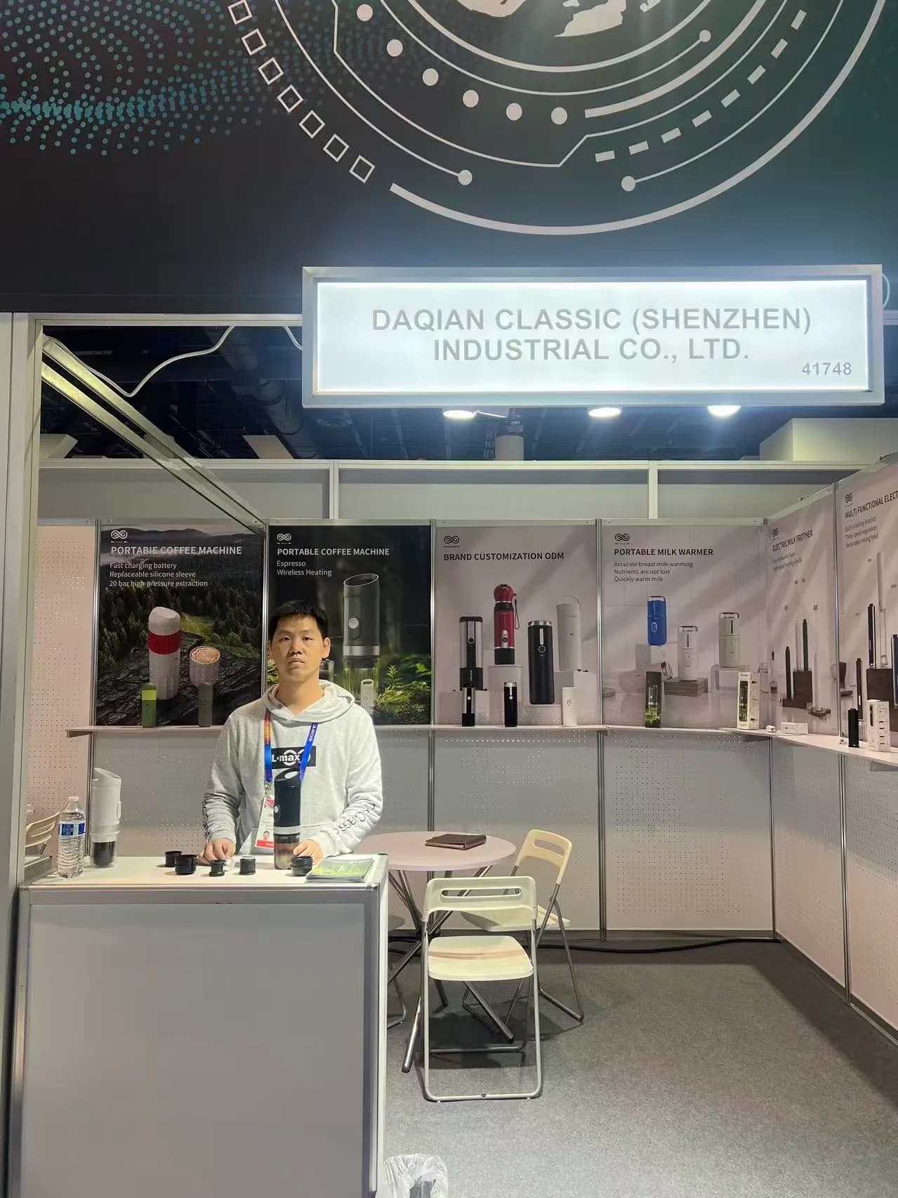 TK Classic exhibition stand with portable coffee machines displayed across the back wall