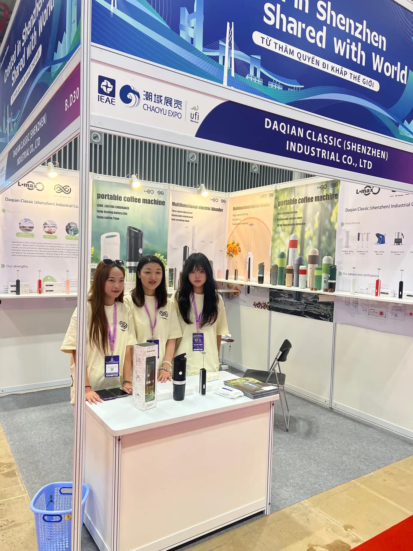 TK Classic team presenting portable coffee machines at an exhibition booth